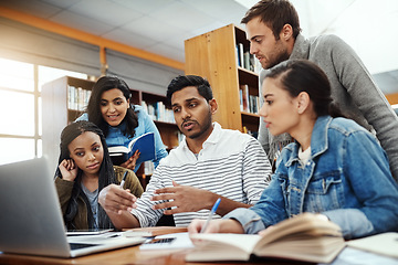 Image showing Computer, talking and students studying in a library for a group project, teamwork and education. Learning, laptop and friends speaking about university notes, knowledge and planning research