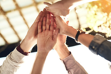 Image showing Business people, hands and high five for team building, success or winning in unity or collaboration outdoors. Group touching hand in agreement, meeting or teamwork for win, support or goals together