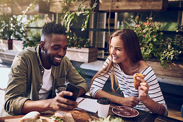 Image showing Restaurant, happy and friends laugh with phone for social media, mobile app and online website. Coffee shop, communication and black man and woman bonding on smartphone for meme, humor and internet