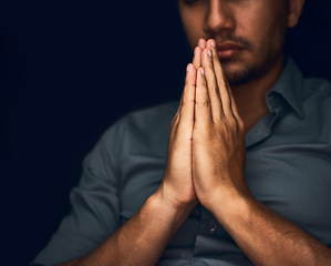 Image showing Praying, worship and hope with hands of man for religion, spirituality and faith. Focus, thinking and peace with closeup of person and mockup space on dark background for belief, prayer and gratitude