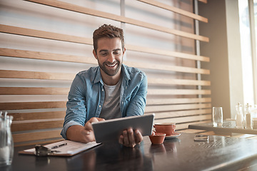 Image showing Smile, internet and a man with a tablet at a cafe for communication, connectivity and administration. Happy, remote work and a male entrepreneur reading from the web with technology at a coffee shop