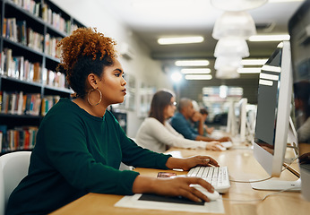 Image showing College, woman and computer in library for learning, education and research website for knowledge. Young university student, desktop and studying online for test, technology and internet information