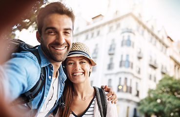 Image showing Selfie, tourist couple and outdoor in a city for travel on a street with a happy smile. Man and woman together for summer holiday memory on urban road for adventure, journey and vacation or freedom