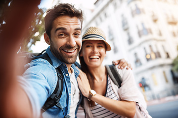 Image showing Tourist couple, happy and selfie for travel on a city street with a partner for holiday memory. Face of a man and woman outdoor on urban road for adventure, journey or vacation for freedom and relax