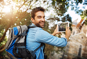 Image showing Man, tourist and tablet for travel photo outdoor in nature with a backpack and smile. Portrait of male person with tech for hiking adventure, journey or vacation photography and freedom or happiness