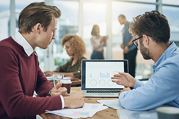 Image showing Laptop, finance and data with a business team doing research together in their office for planning. Computer graph or chart with a man employee and colleague meeting to discuss financial strategy