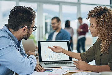 Image showing Laptop, finance and graph with a business team doing research together in their office for planning. Computer data or chart with a man employee and woman colleague meeting to discuss strategy