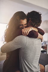 Image showing Woman, man and hug in home for love, care and quality time together with commitment to relationship. Happy young couple, hugging and romance of lovers, smile and relax with trust of partner in house