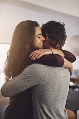 Image showing Happy woman, man and hug in home for love, care and quality time together with commitment to relationship. Young couple, hugging and anniversary of lovers, smile and happiness of loyalty to partner