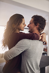 Image showing Woman, man and hug for love, care and quality time together with commitment to relationship at home. Happy young couple, hugging and romance of lovers, smile and relax with trust of partner in house