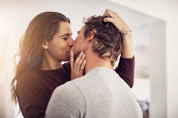 Image showing Face of happy woman, man and kiss with love in apartment for romance, intimacy and special moment together. Young couple kissing in home for romantic relationship, happiness and passionate partner