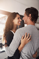 Image showing Happy woman, man and hug in apartment for love, care and quality time together with commitment to relationship. Young couple, hugging and smile for anniversary of lovers, relax and loyalty to partner