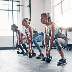 Image showing Group, exercise and women training, kettlebell and workout goal with wellness, healthy lifestyle and sports. Female athletes, girls and friends with gym equipment, balance and stretching for cardio