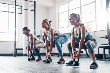 Image showing Kettlebell, sports and women with fitness, workout and progress with balance, stress relief or wellness. Female athletes, friends or group with gym equipment, goal and exercise with healthy lifestyle