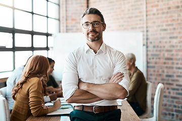 Image showing Portrait, leader and man with arms crossed, startup success and manager with teamwork. Face, male employee and entrepreneur with confidence, collaboration and leadership with new project and meeting