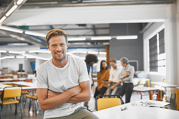 Image showing Man, startup and modern office in portrait, arms crossed or smile with excited face for career. Young businessman, creative professional person or sitting on table in workplace with web design job