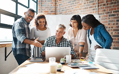 Image showing Teamwork, group and colleagues using a laptop together or collaboration on a new project and in a modern office. Diversity, idea and businesspeople in a meeting or having a conversation and work