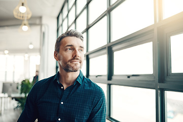 Image showing Thinking, startup and man at office window, creative ideas for business project or entrepreneur at design agency. Young boss with creativity, idea and focus, businessman with future plan in workspace