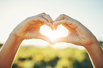 Image showing Girl with heart hands, nature and sunshine, sustainability and eco friendly earth care and natural farm landscape. Conservation, sustainable farming and love hand sign emoji, woman with green fingers