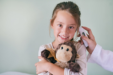 Image showing Healthcare, portrait and a girl at the pediatrician for an ear checkup or appointment in the hospital. Medical, temperature or thermometer with a happy and adorable female child at the health clinic