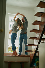 Image showing Love, couple and dancing in home, bonding and having fun together for romance. Dance, happy and man and woman, funny and care, affection and enjoying quality time by stairs to relax on anniversary.