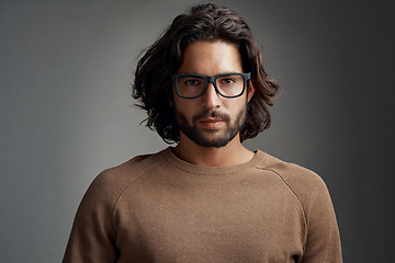 Image showing Portrait, glasses and serious man in studio isolated on a gray background. Face, nerd and handsome male person from Australia with spectacles, eyewear or frames for fashion, stylish and aesthetic.