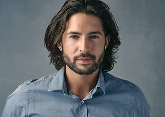 Image showing Portrait, confident and business man with long hair, beard on gray studio background. Face, businessman and model with professional focus of entrepreneur, manager or casual corporate worker