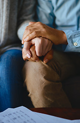 Image showing Holding hands, senior couple and closeup of life insurance note with paperwork in living room. Home, sofa and elderly people with empathy, hope and trust with solidarity for bills problem in a lounge