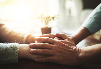 Image showing Holding hands, senior couple and retirement support with kindness and marriage. Home, sofa and elderly people with empathy, hope and trust with solidarity for finance problem in a lounge together