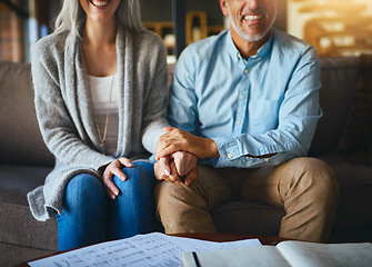 Image showing Holding hands, happy senior couple and life insurance support with paperwork in a living room. Home, sofa and elderly people with empathy, hope and trust with solidarity for investment in a lounge