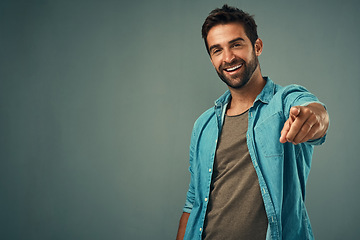 Image showing Pointing, mockup or portrait of happy man in studio for choosing accountability, motivation or decision. Space, smile or male model with hey you hand gesture isolated on background for option offer