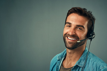 Image showing Happy man, call center and portrait of consultant on mockup space against a grey studio background. Face of friendly male consulting agent with smile and headset in contact us, help or online advice