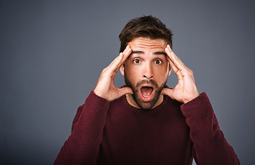 Image showing Wow, portrait and man mind blown in studio with gossip, drama or secret against grey background. Omg, face and surprised male with wtf emoji for fake news, announcement and rumor while isolated