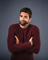 Image showing Doubt, shrug and portrait of man in studio unsure against a grey background space. Confused, face and shrugging male with dont know expression, puzzled and pensive with choice and decision isolated