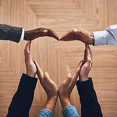 Image showing Diversity, heart or hands of business people in support for trust, teamwork or community inclusion in office. Love gesture, above or employees in group collaboration with hope or kindness for charity