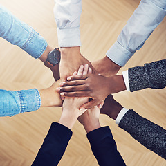 Image showing Diversity, partnership or hands of business people in support for faith, teamwork or strategy in office. Closeup, above or employees in group collaboration with hope or mission for goals together