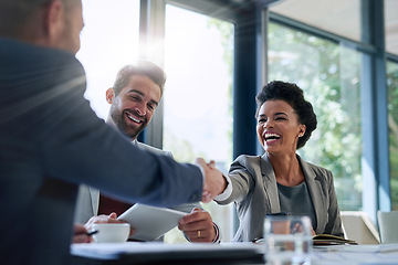 Image showing Meeting, partnership and business people shaking hands in the office for a deal, collaboration or onboarding. Diversity, professional and employees with handshake for agreement, welcome or greeting.