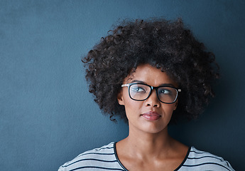 Image showing Optometry, eye care and woman with glasses in studio with thinking, pensive or idea face expression. Optical wellness, healthcare and African female model with spectacles isolated by blue background.