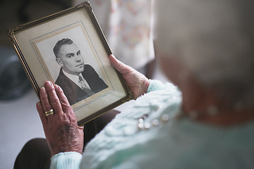 Image showing Senior woman, picture frame and memory of husband for nostalgia, history and mourning death. Closeup, elderly and lonely widow with photograph of partner to remember memories, love and grieving