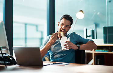 Image showing Business, man and eating noodles in office at desk, laptop and working in startup company at night. Hungry young male employee, fast food and late dinner at computer technology in agency at evening