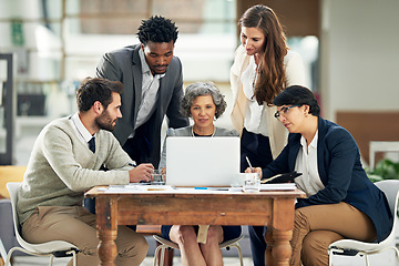 Image showing Collaboration, laptop or business people in meeting typing up ideas, strategy or planning a team project. Mentor, manager or employees learning in group coaching with leadership or vision in office