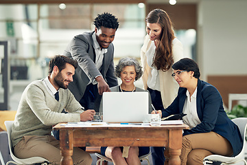 Image showing Business people, laptop or black man in meeting discussion for ideas, strategy or planning a project. Digital, teamwork or group of employees pointing or speaking with leadership for growth in office