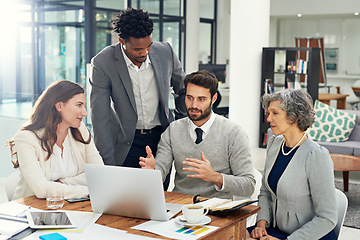 Image showing Laptop, teamwork or businessman speaking in meeting for ideas, strategy or planning a startup company. CEO, diversity or employees in group discussion or talking with leadership for growth in office