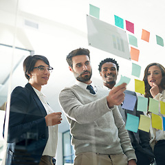 Image showing Business people, teamwork and planning with sticky note, brainstorming or talk for solution, idea or goal. Group, glass board and focus with concentration for proposal, project or team in workplace