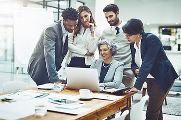 Image showing Business people, laptop or woman coaching in meeting typing up ideas, strategy or planning a project. Mentor, teamwork or employees learning in group training with leadership or vision in office