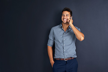 Image showing Space, happy and phone call with business man in studio for communication, networking and contact. Connection, smile and conversation with male employee on dark background for mockup and technology