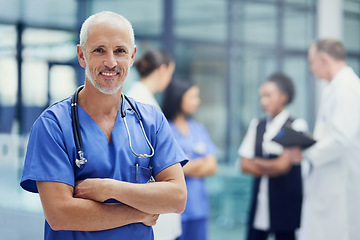 Image showing Portrait of senior doctor or nurse with mockup, smile and happiness in hospital, confidence in medical career. Health care, confident help and medicine, happy man or nursing professional in workplace