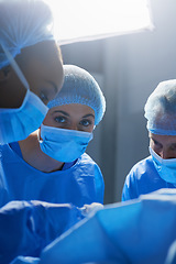 Image showing Surgery, operating room and portrait of woman doctor with team, healthcare and teamwork in professional medicine. Medical innovation, emergency and focus, surgeon with expert staff in hospital icu.