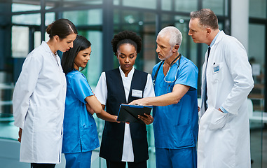 Image showing Planning, clipboard and medical with doctors in hospital for consulting, teamwork and communication. Medicine, healthcare and checklist with group of people for support, review and analysis