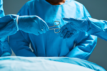 Image showing Surgery, teamwork and hands of doctor with scissors for healthcare, assistance and focus on professional medicine. Medical innovation, tools and surgeon with expert staff in hospital operating room.